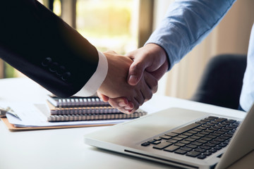 Close up of handshake.business people shaking hands, finishing up meeting