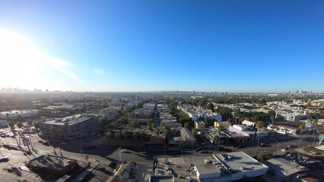 Dolly Right Above Blue Skies & Sunset Boulevard Traffic Facing Downtown Los Angeles & Century City in Hollywood, California 4K