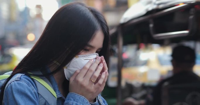 Woman wearing mask to protect herself at city. Health care and medical concept.