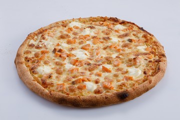 Pizza with salmon and cheese isolated on a white background. Close-up.