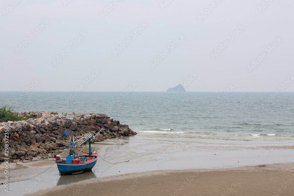 Wall mural fishing boats are parked on the beach by the sea