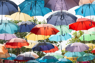 Fototapeta na wymiar Colorful umbrellas floating in the sky