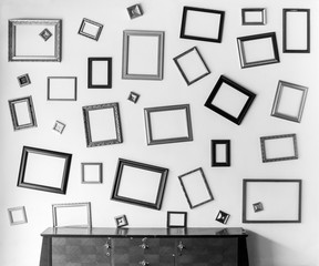 Monochrome tone or Black and white abstract background of old wood table and picture frame on wall.