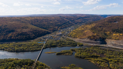 Obraz premium bridge over the river top view. mountain river.