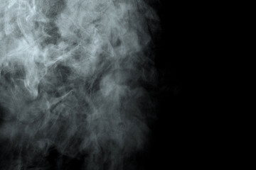 Abstract  powder or smoke isolated on black background
