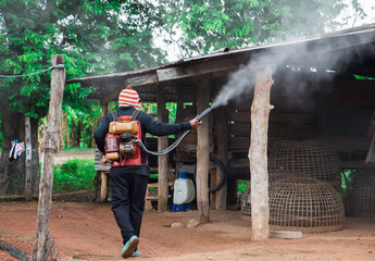 A man  use a sprinkler ULV type for kill mosquito carrier of Zika virus and dengue fever it...