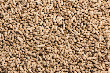 Texture background of peanut vegetable pattern bulk  raw peanut  grains.