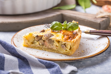 Homemade quiche lorraine with chiken, mushrooms, cheese. top view. Cooking. Spices, butter.  Tart.