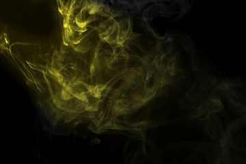 Abstract  golden powder or smoke isolated on black background