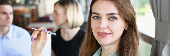 Beautiful smiling cheerful girl at workplace