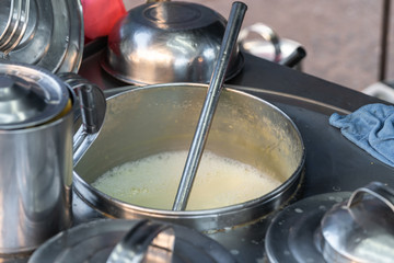 Close-up of Boiling soybean milk in big pot at the street food market, Thailand.