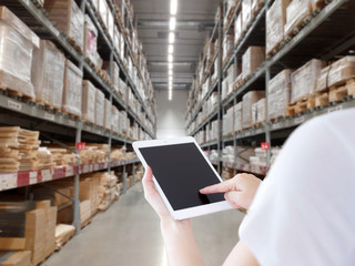 Female manager working at modern warehouse