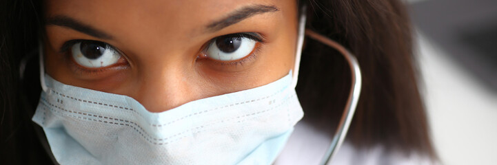 Black female doctor in a face mask