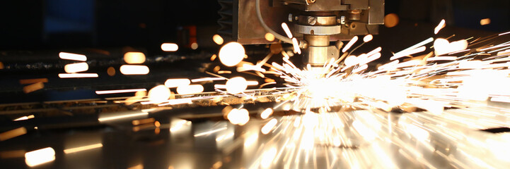 Sparks fly out machine head for metal processing