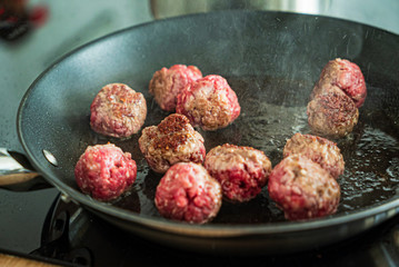  chef making meatballs on the kitchen