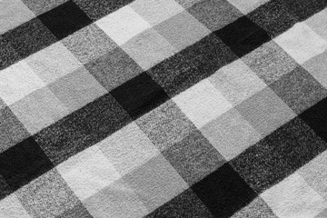 Fototapeta premium Black and white checkered plaid fabric texture for background. tartan texture