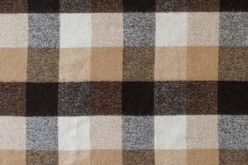 Fototapeta premium Brown checkered wool plaid fabric texture. tartan texture