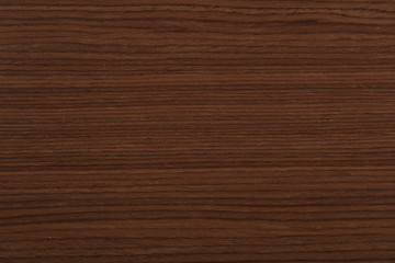 Fototapeta premium Awesome dark brown nut veneer background. High quality wood texture.