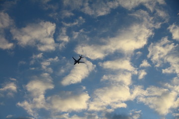 Fototapeta na wymiar a plane through clouds (bulutların arasındaki bir uçak)