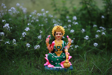 Idol of Mahalakshmi, Diya and Tulsi on the auspicious occasion of Deepawali