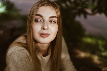 beautiful girl with hope looks into the distance, the background is blurred