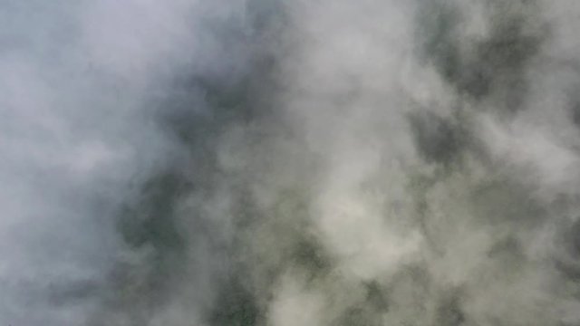 Landscape of Morning Mist with Mountain Layer. Wide shot aerial drone footage. Mountain view morning of Top hill around with the ocean of mist with clouds moving in cloudy sky background. 