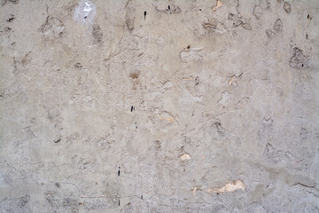 Obraz premium Concrete surface painted in light pastel colors with a rough texture.