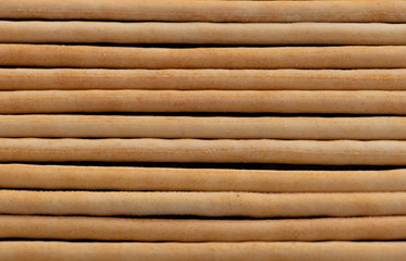 Tasty Italian bread sticks close up texture backgrond
