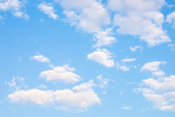 The view of blue sky and white clouds in the natural light of the sunny day. 
