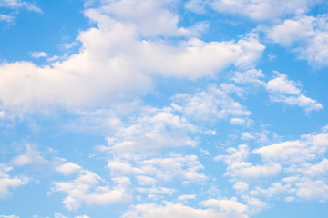 The view of blue sky and white clouds in the natural light of the sunny day. 