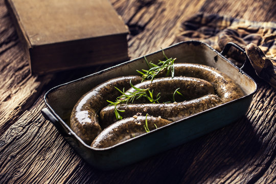 Roasted sausages in pan with rosemary. Traditional european food bratwurst jaternice or jitrnice