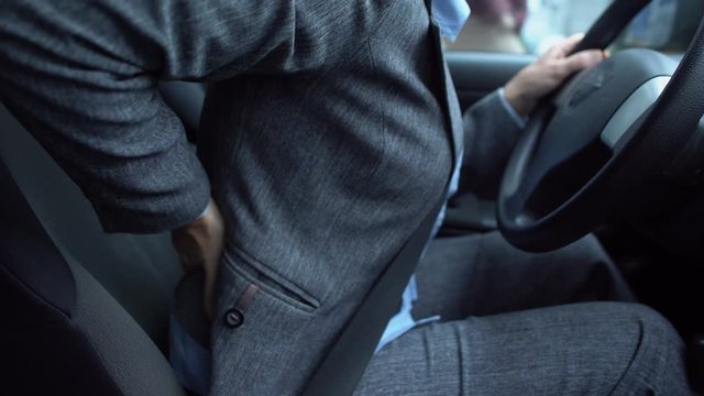 Lady massaging her numb lower back, problems with spine, sedentary lifestyle