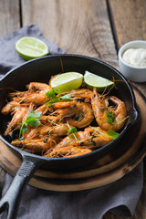 Fried prawns with lime in a pan