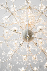 Chandelier. A closed up of a chandelier with a soft focus on the middle round diamond. Shallow depth of field, worm eye view.