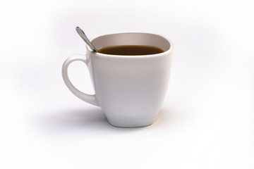 Obraz premium White cup of coffee with a spoon on an isolated background. Black cappuccino drink in a bowl