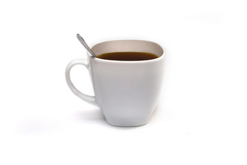White cup of coffee with a spoon on an isolated background. Black cappuccino drink in a bowl