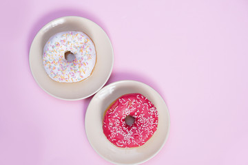 Beautiful juicy donut with a sweet cream..Cupcake on a pink background for kitchen design.