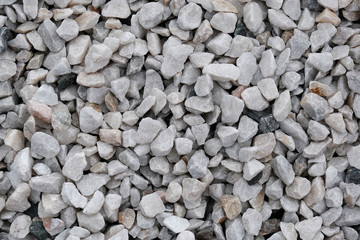 Decorative stone construction crumb close-up macro photo of a stone designer background. Marble crumb. Pebble.