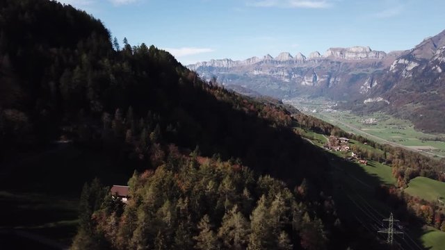 Drone view of forest, Swiss Alps and valley around Mels, Switzerland