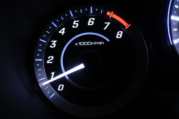 speedometer on black background