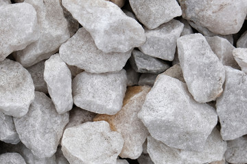 Decorative stone construction crumb close-up macro photo of a stone designer background. Marble crumb. Pebble.
