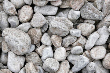 Fototapeta na wymiar Background made of a closeup of a pile of pebbles.