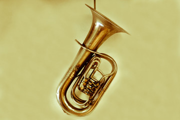 an ancient trombone on a yellow background - obrazy, fototapety, plakaty
