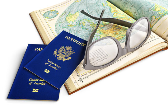 World travel, choosing vacation destination and tourism concept, a pair of passports and glasses on a book page open on a world map, white background