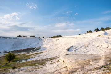 Pamukkale termal waters with the white rocks. Pamukkale meaning cotton castle is beautiful landscape in Denizli, Turkey.