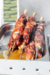 Fresh meat on skewers for sale in food market