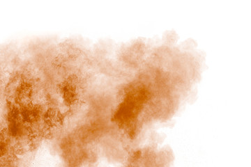 Fototapeta na wymiar Orange powder explosion on white background.Orange color dust splash clouds.