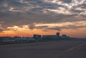 The sun rises over Warsaw Airport in Poland