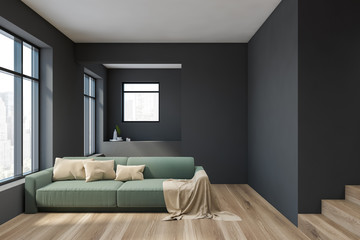 Fototapeta premium Gray living room interior with green sofa