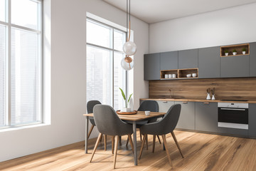 White and gray kitchen corner with table